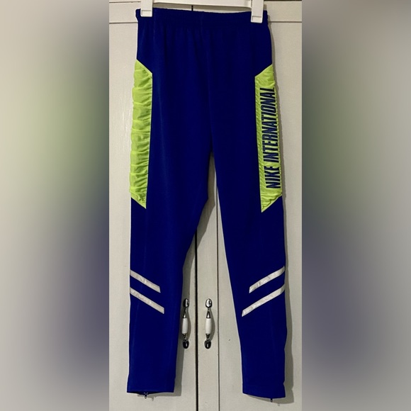 Vintage NIKE INTERNATIONAL ' Blue Windpants Sweatpants - Picture 1 of 4